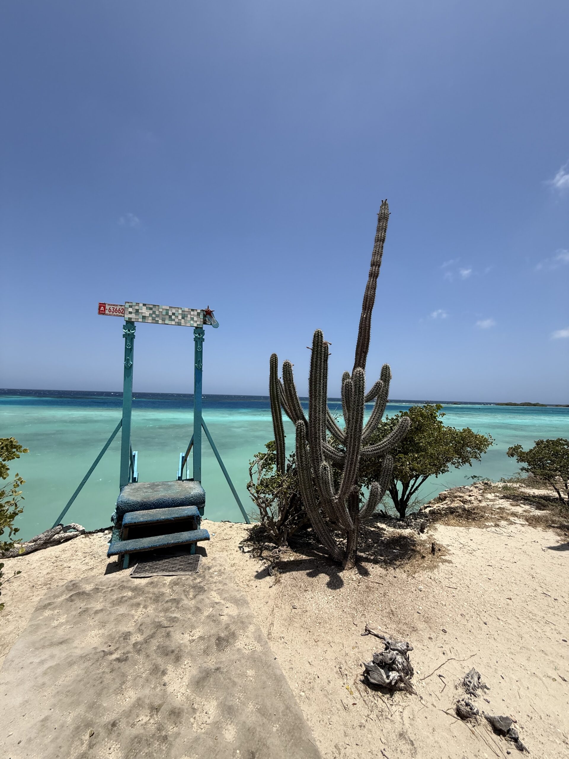 The famous painted-swing entry point at Mangel Halto — that turquoise gradient in the water isn't a filter, it really looks like that in person