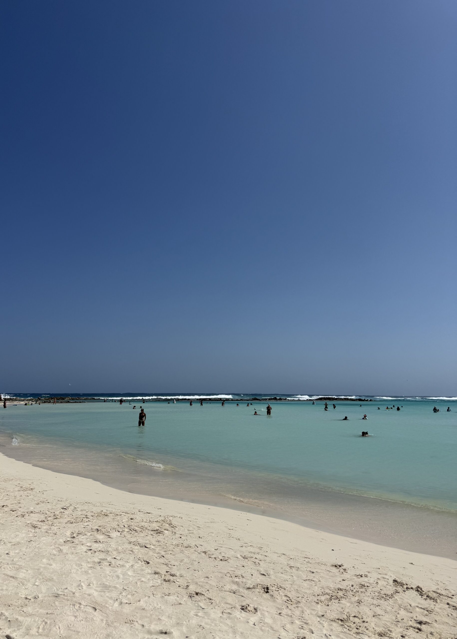 Baby Beach at midday — that reef line in the distance is what makes the whole bay feel like a natural swimming pool, no waves and easy footing all the way out