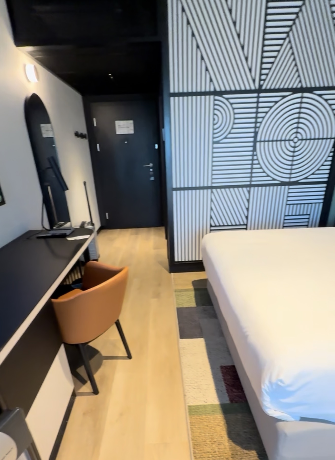 Desk, TV and entryway in our king room at Hyatt Place Kraków