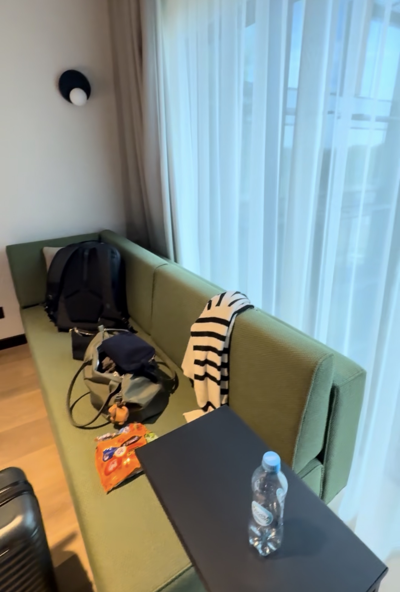 The sofa bed and floor-to-ceiling window in our room at Hyatt Place Kraków