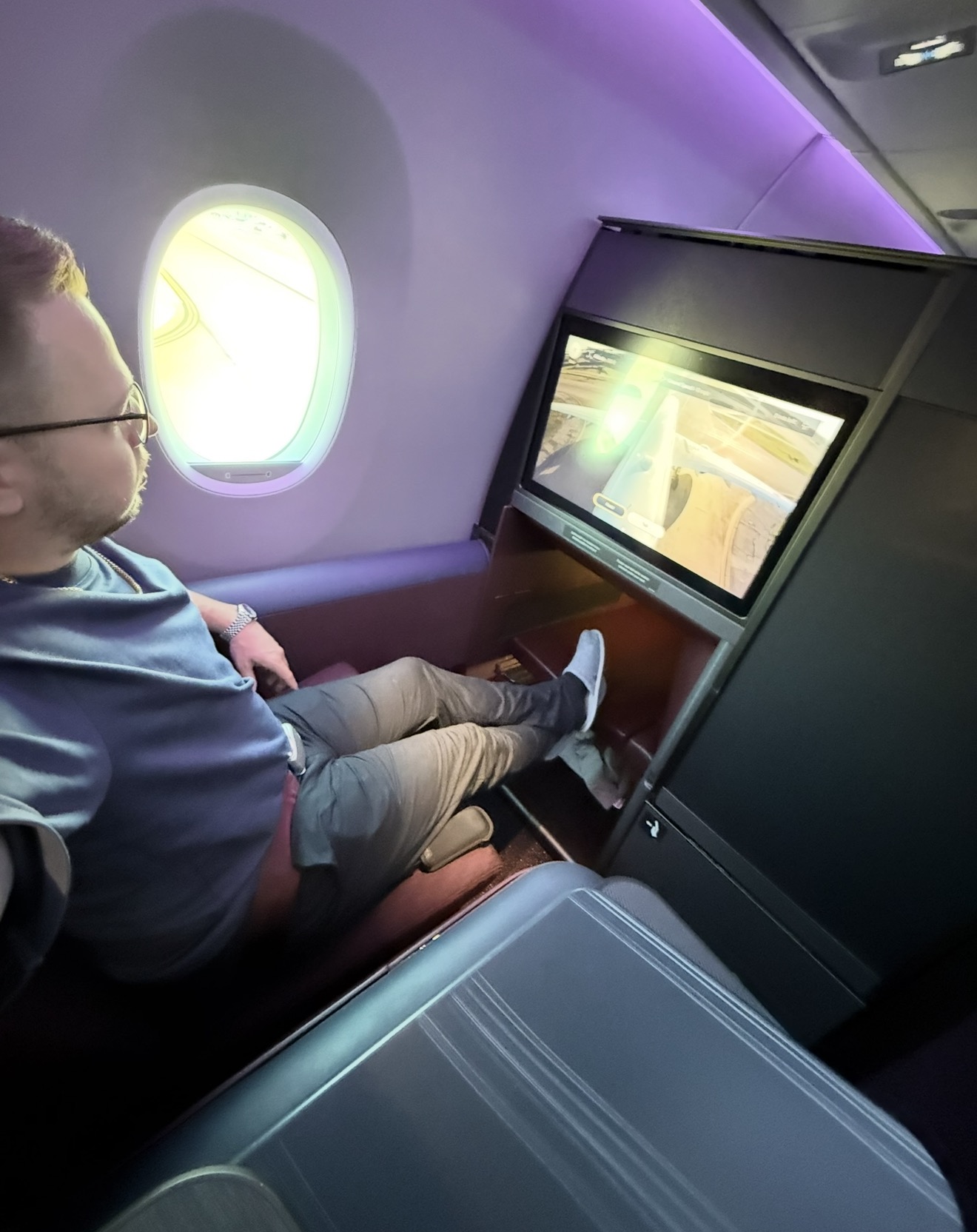 Reclined in JAL A350-1000 business class with the cabin mood lighting on