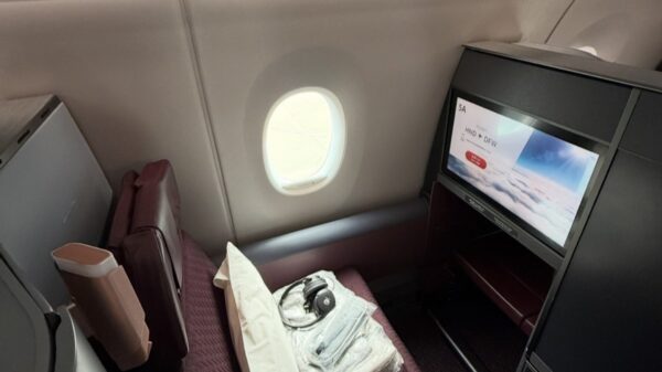 JAL A350-1000 business class suite 5A, with the screen showing the Haneda to Dallas routing