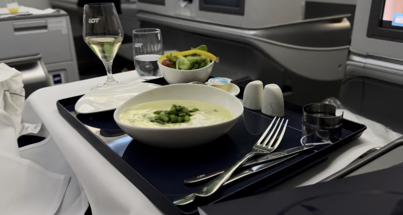 Asparagus cream soup served on a full tray with LOT-branded glassware