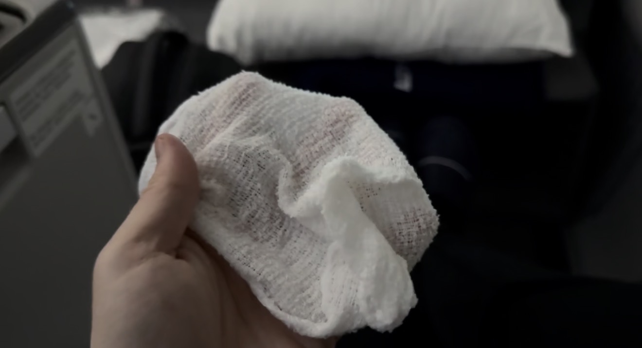The hot towel handed out before departure in LOT 787 business class — noticeably thin